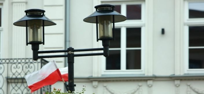 The Polish flag in front of a building in Poland