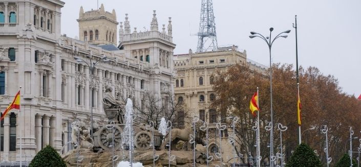 The Royal Palace and the Spanish flag in Madrid, Spain